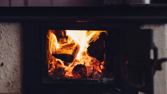 A wood-burning fireplace with clean, bright flames from well-dried firewood